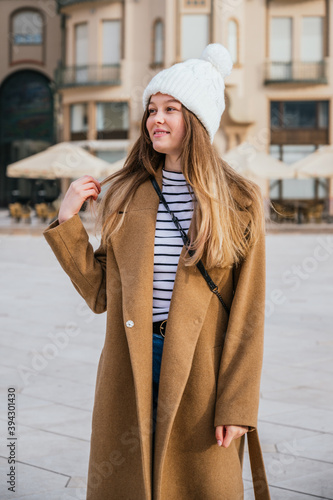 Obraz na płótnie Portrait of a beautiful young woman with winter clothes w salonie