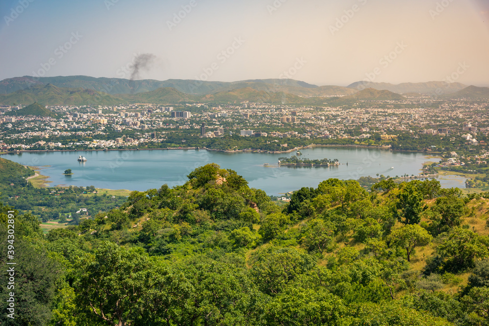 Panoramic aerial view of Udaipur city also known as city of lakes from  Monsoon palace at Sajjangarh, Rajasthan. It is the historic capital of the kingdom of Mewar.
