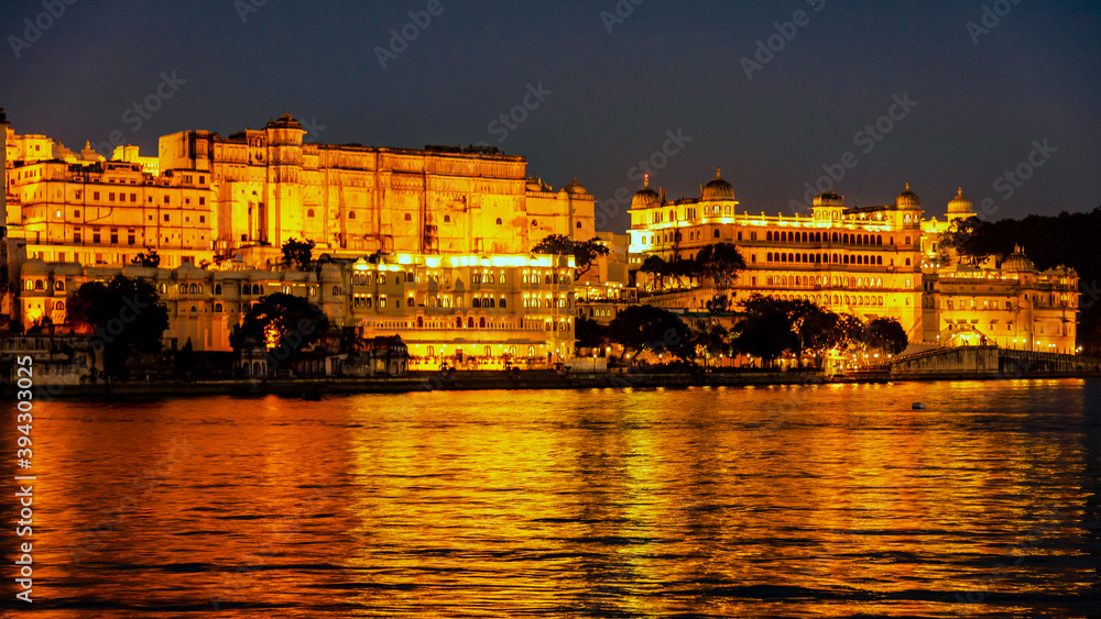Night view of city palace from Ambrai Ghat at Udaipur, Rajasthan, India