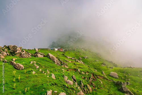 Panoramic view from Triund hill top at Mcleod ganj, Dharamsala, Himachal Pradesh, India. Triund hill top offers view of himalyan peaks of Dhauladhar range. photo