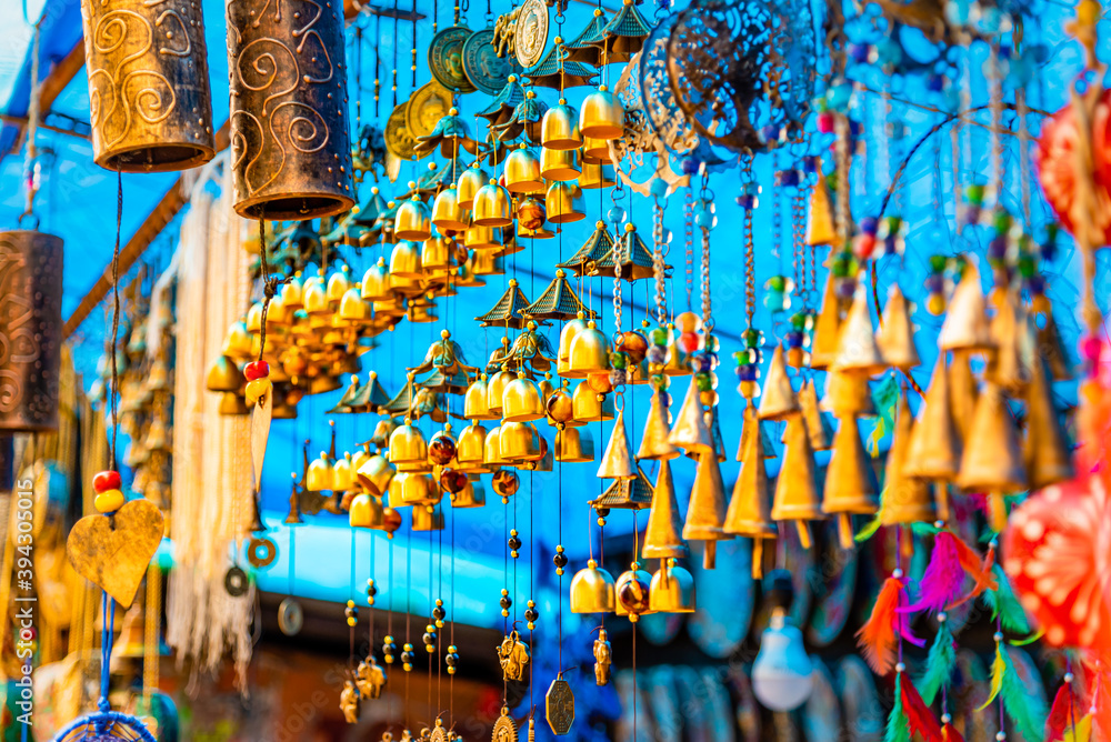 Naklejka premium Tibetian traditional handicraft Wind chimes, Prayer flags & colorfull dream catcher at Mcleod ganj, dharamshala streets, himachal pradesh, India