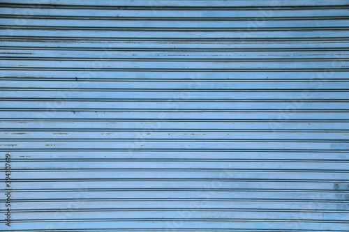 Background from corrugated metal sheet door