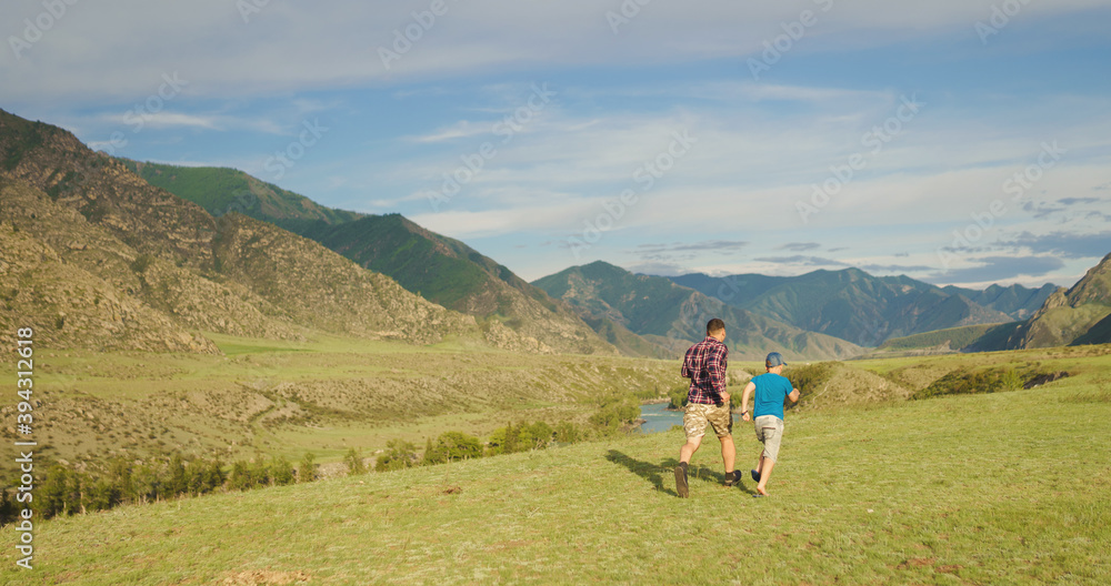father and son running in the countryside father and son running in the countryside