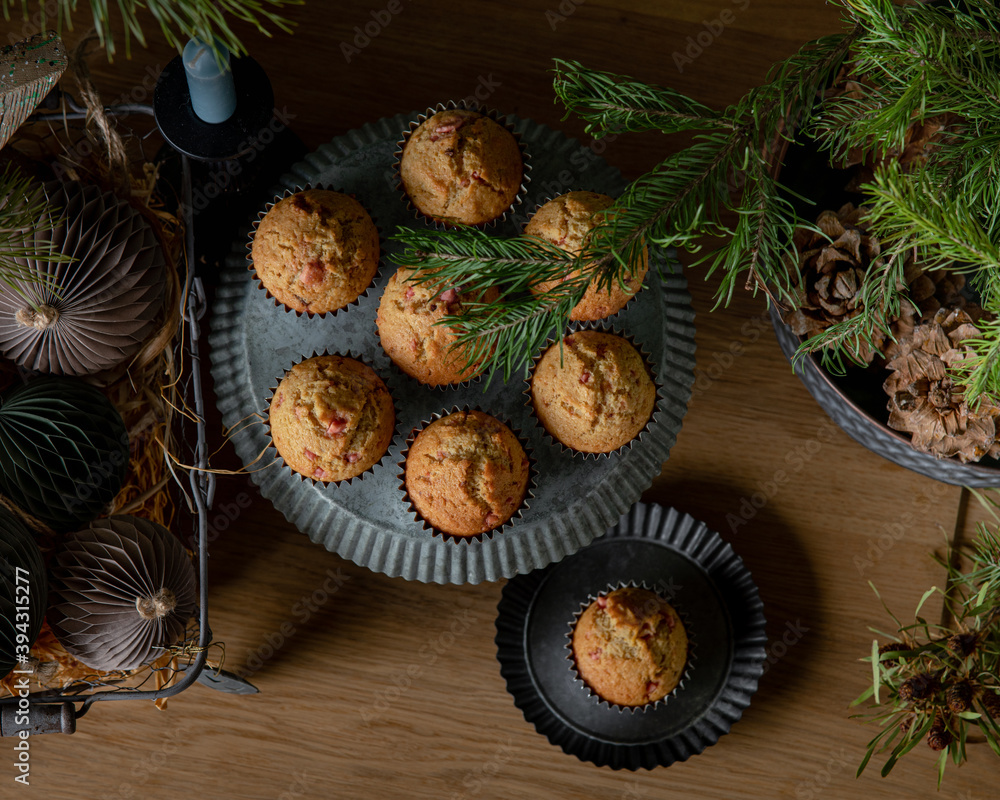 Top view of Christmas cupcakes and homemade paper Christmas ornaments and vintage decorations in Scandinavian or nordic style. Beautiful flat lay in natural green and wooden tones Top view of Christmas cupcakes and homemade paper Christmas ornaments and vintage decorations in Scandinavian or nordic style. Beautiful flat lay in natural green and wooden tones