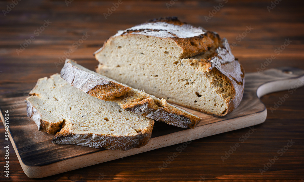 freshly baked bread on dark gray kitchen table freshly baked bread on dark gray kitchen table