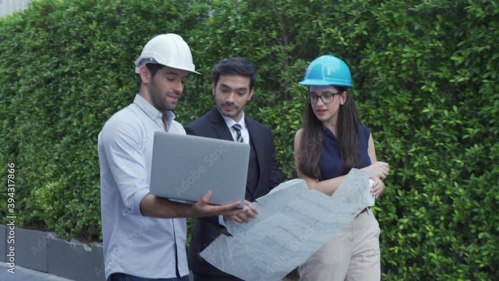 Engineer's team and Investor Use Laptop Computer on Construction and Discussing Plan Details Engineer's team and Investor Use Laptop Computer on Construction and Discussing Plan Details