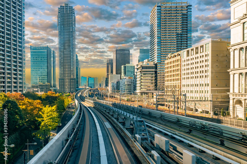 Transport system of Japan. Railway and automobile tracks in the Japanese city. Transport of the Japanese capital. Road network on the background of office buildings. Travel to Japan.