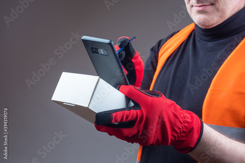 A man with a box and a smar...
