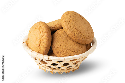 basket with oatmeal cookies isolated on white background