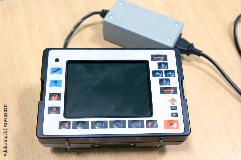 Ultrasonic flaw detector at the plant during accurate measurement of steel thickness at machine-building plant. Precision instrument Ultrasonic flaw detector at the plant during accurate measurement of steel thickness at machine-building plant. Precision instrument