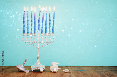 Religion image of jewish holiday Hanukkah background with menorah (traditional candelabra) and candles