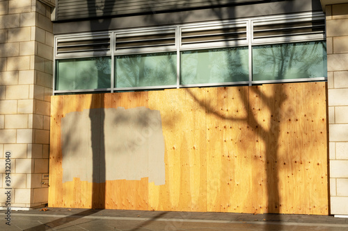 Canvas Print Exterior of business, store, restaurant boarded up with plywood sheets