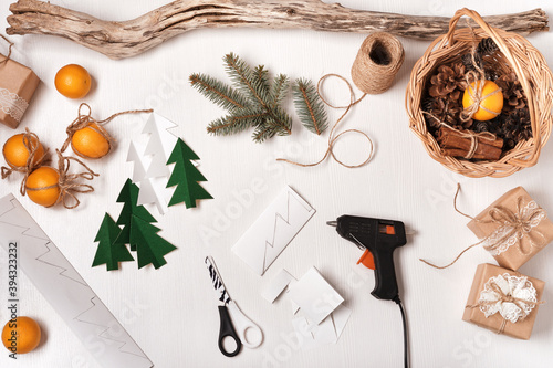 DIY Christmas home decor from natural materials. Elements for making garlands paper, cones, twine photo