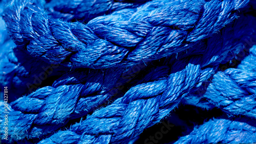 Fotografie Yachting ropes or lines in pile, blue color texture, synthetic fibres