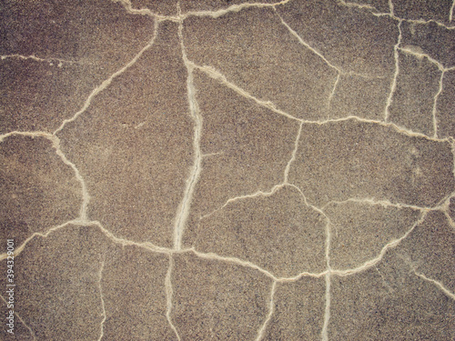Abstract background of a cracked wall. Toned image.