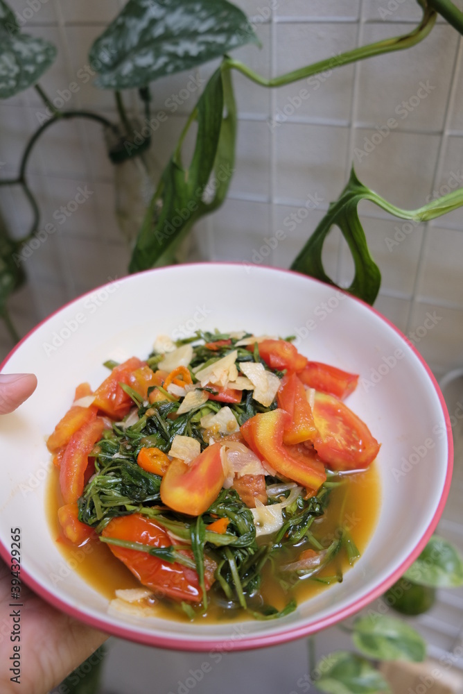 Stir fried water spnach or known as tumis kangkung in Indonesia. Stir fried water spnach or known as tumis kangkung in Indonesia.