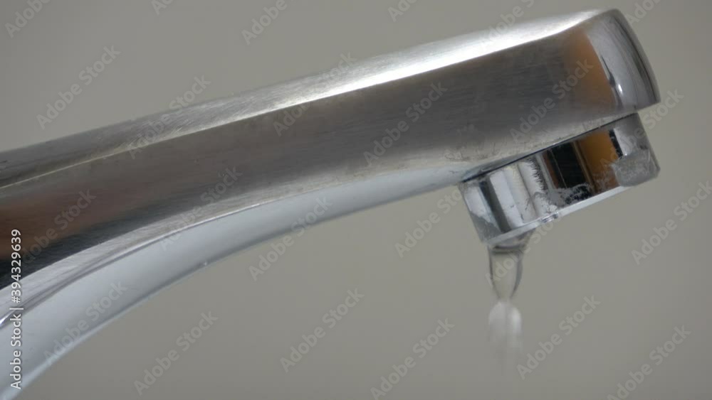 Dripping old faucet. Water dripping from a tap close up. Lack of clean water, reckless use of resources Dripping old faucet. Water dripping from a tap close up. Lack of clean water, reckless use of resources