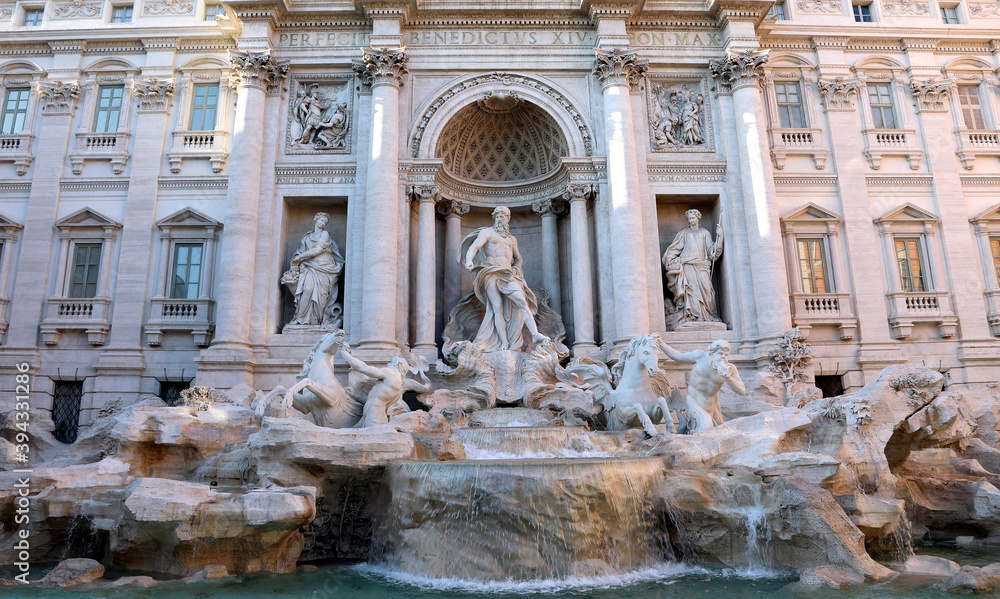 statues of the Trevi fountain with the God Neptune in the center