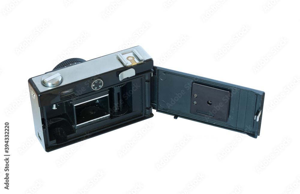 An old film camera with an open back cover. An old film camera with an open back cover.