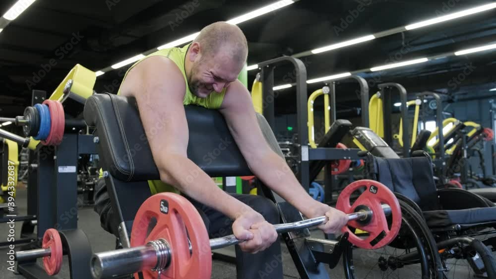Disabled man training in the gym of rehabilitation center Disabled man training in the gym of rehabilitation center