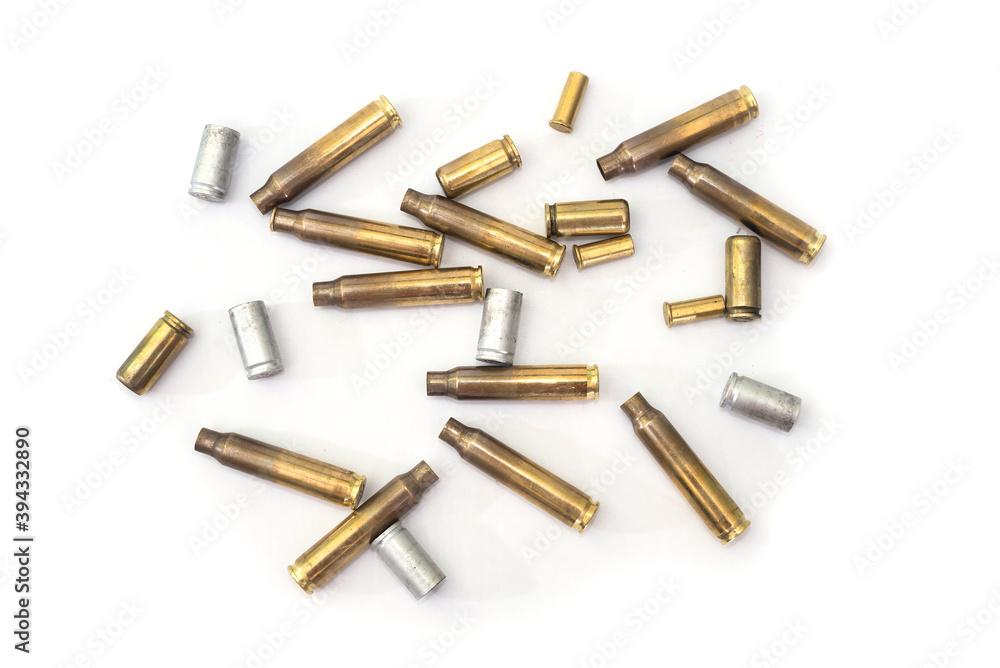 empty cases for carbine and rifle isolated on white background. Shooting ammunition, close-up. empty cases for carbine and rifle isolated on white background. Shooting ammunition, close-up.