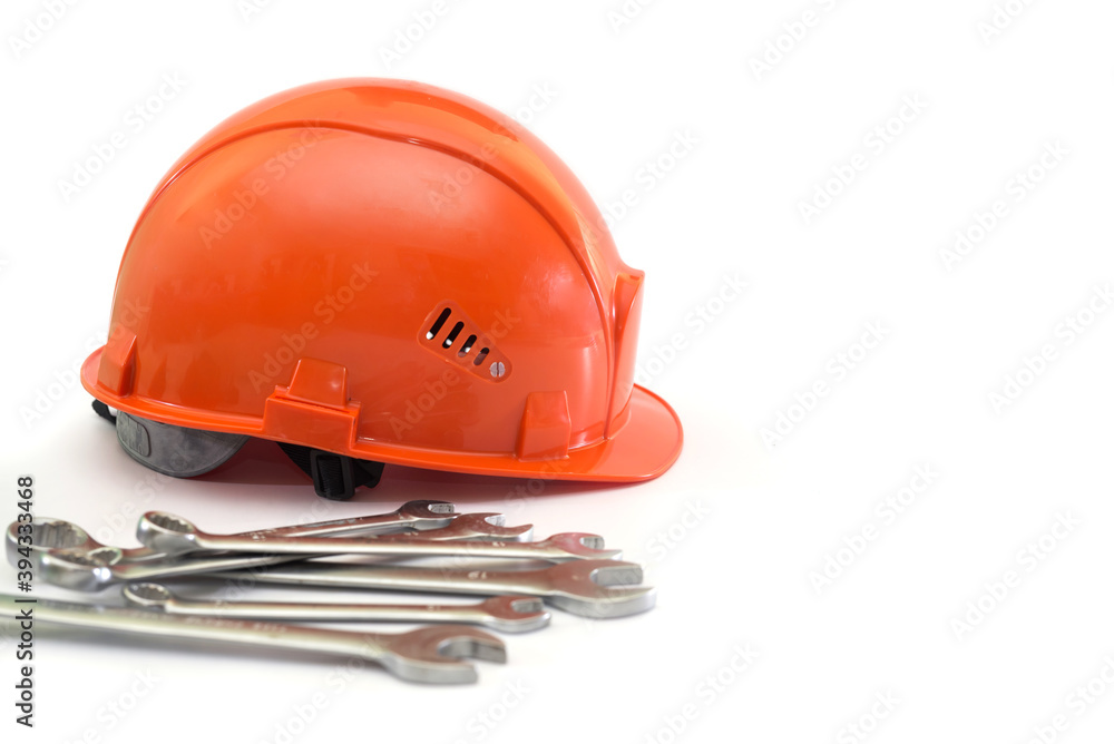 hard hat and wrenches isolated on white background hard hat and wrenches isolated on white background
