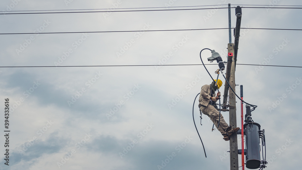 Lineman climb concrete pole and use clamp stick grip all types to connect the single phase transformer to the distribution system.