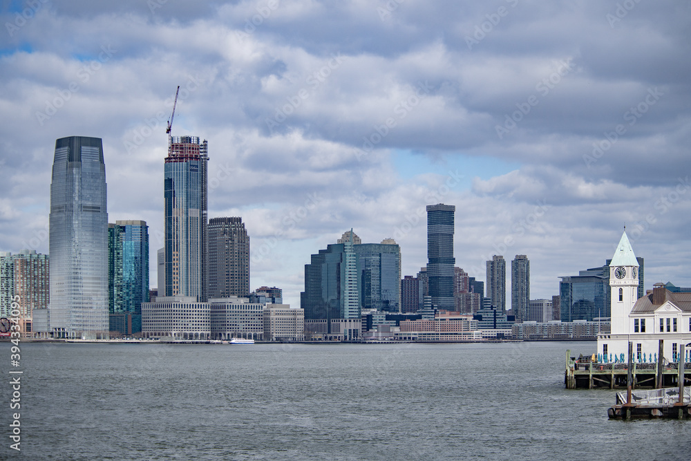 Obraz premium Jersey City modern skyscrapers skyline including from New York Harbor near New York City NYC, New Jersey NJ, USA.