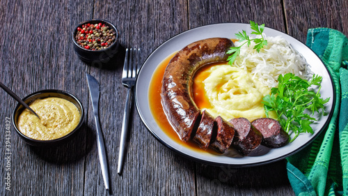 German food: blutwurst with potato and sauerkraut photo