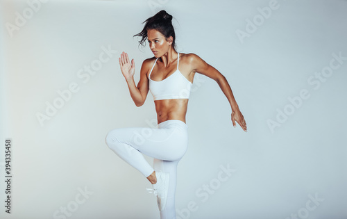 Monochrome portrait of a fit woman exercising