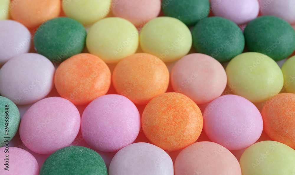 Rows of Beautiful Pastel Colored Sugar Coated Candies for Abstract Background or Banner Rows of Beautiful Pastel Colored Sugar Coated Candies for Abstract Background or Banner