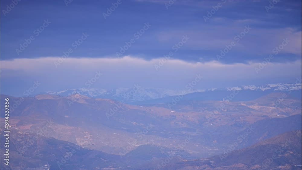 Time lapse of clouds moving over Sierra Nevada mountain range in Spain. Nature landscape. Popular tourist destination. Time lapse of clouds moving over Sierra Nevada mountain range in Spain. Nature landscape. Popular tourist destination.