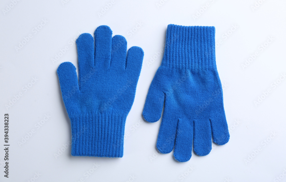 Pair of stylish woolen gloves on white background, flat lay Pair of stylish woolen gloves on white background, flat lay