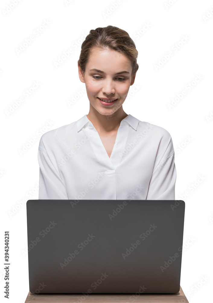 Smiling businesswoman using laptop, isolated Smiling businesswoman using laptop, isolated