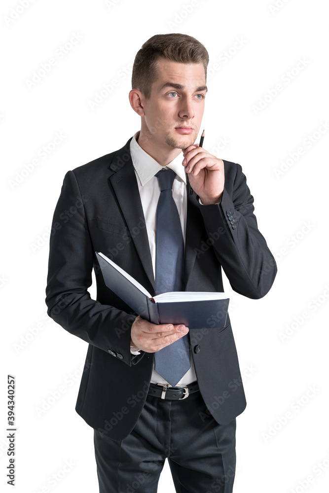 Thoughtful young businessman with book, isolated Thoughtful young businessman with book, isolated