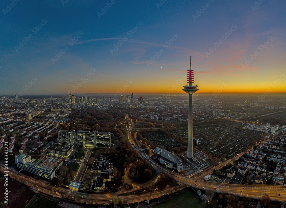 Fototapeta premium Drone image of the Frankfurt skyline with television tower in the evening during a colorful and impressive sunset