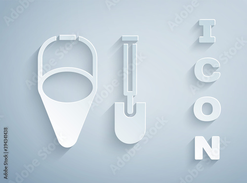 Paper cut Fire shovel and cone bucket icon isolated on grey background. Paper art style. Vector.