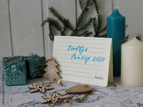 Russia, Moscow region, Lobnya, 11/21/2020: Christmas composition on a white wooden background. A note with the words 