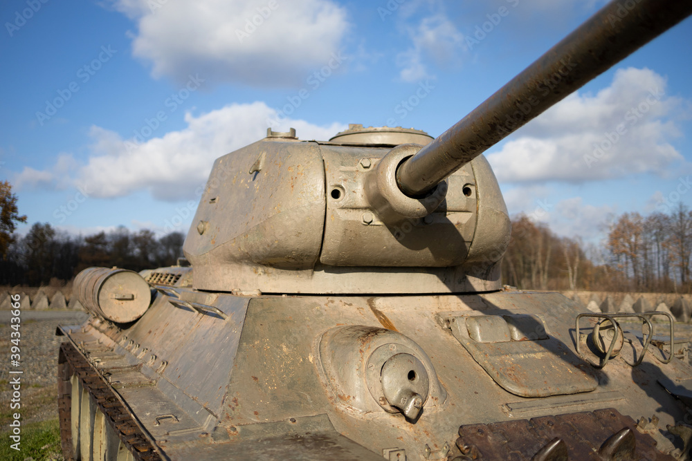 Old aged soviet tank from second world war - armored fighting vehicle. Turret detail. Shallow focus.