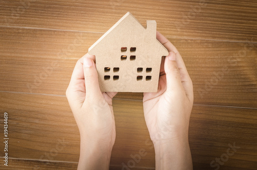 Home idea in human hand dream to sweet family