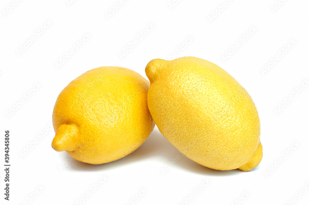 Two fresh, ripe lemon on a white background Two fresh, ripe lemon on a white background