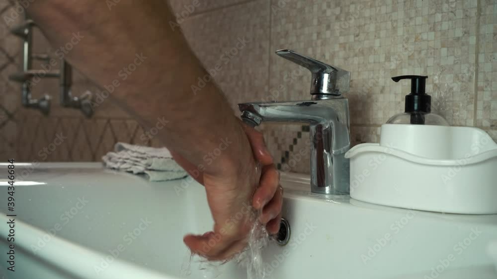 a man washes his hands with soap and a towel a man washes his hands with soap and a towel