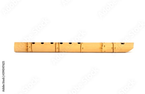 Peruvian flute isolated on white with shadow. South American national musical instrument. A folk musical instrument of the Indians.