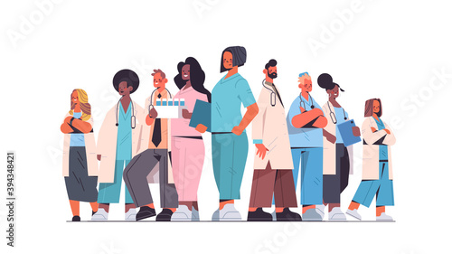 team of medical professionals mix race doctors in uniform standing together medicine healthcare concept horizontal full length vector illustration