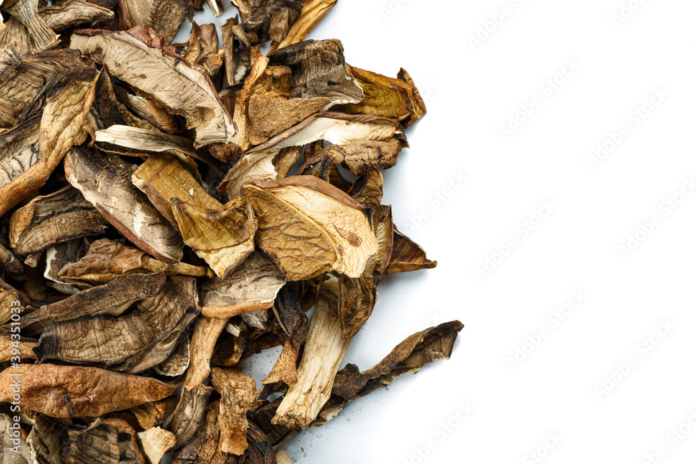 Dried mushrooms on white background. Space for text. Dried mushrooms on white background. Space for text.