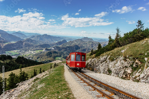 Obraz na płótnie SCHAFBERGBAHN Cog Railway running from St. Wolfgang up the Schafberg, Austria.Journey to the top of Alps through lush fields and green forests.Beautiful mountain panorama.View of lake Wolfgangsee w salonie