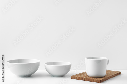 Three circles stand on a white surface against a white background. Copy space, mock up.