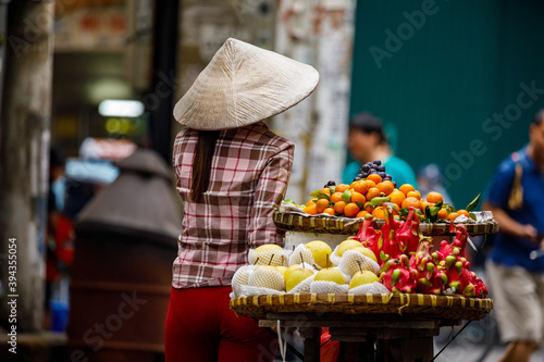 Woman at the street market of Hanoi in Vietnam
