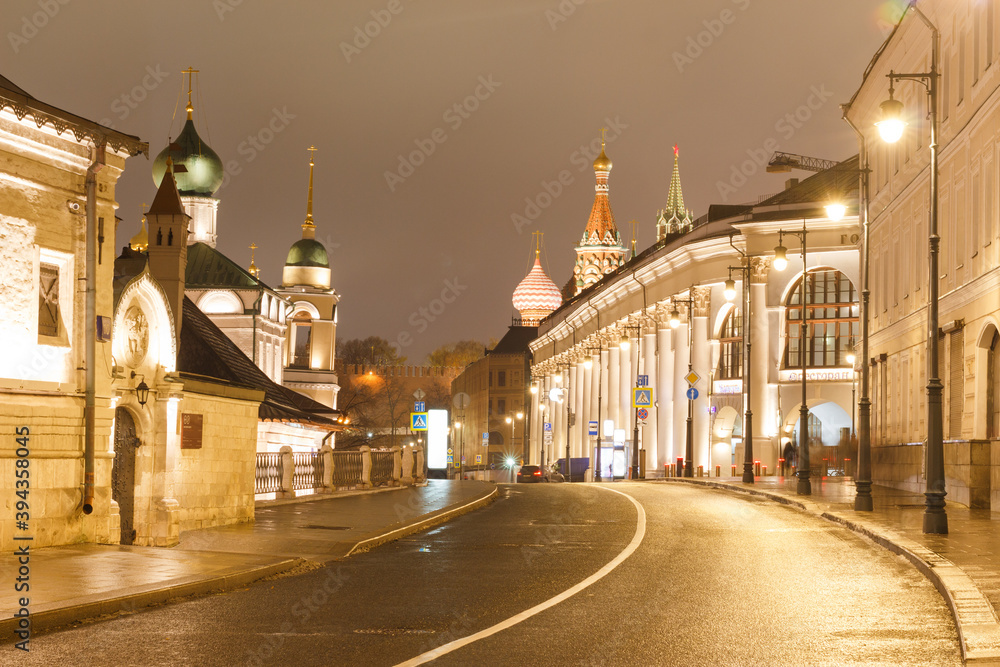 Fototapeta premium Moscow, Russia, Nov 20, 2020: Varvarka streen in night. Gostiny dvor ( exhibition ground), church and st. Basil's catherdral in background