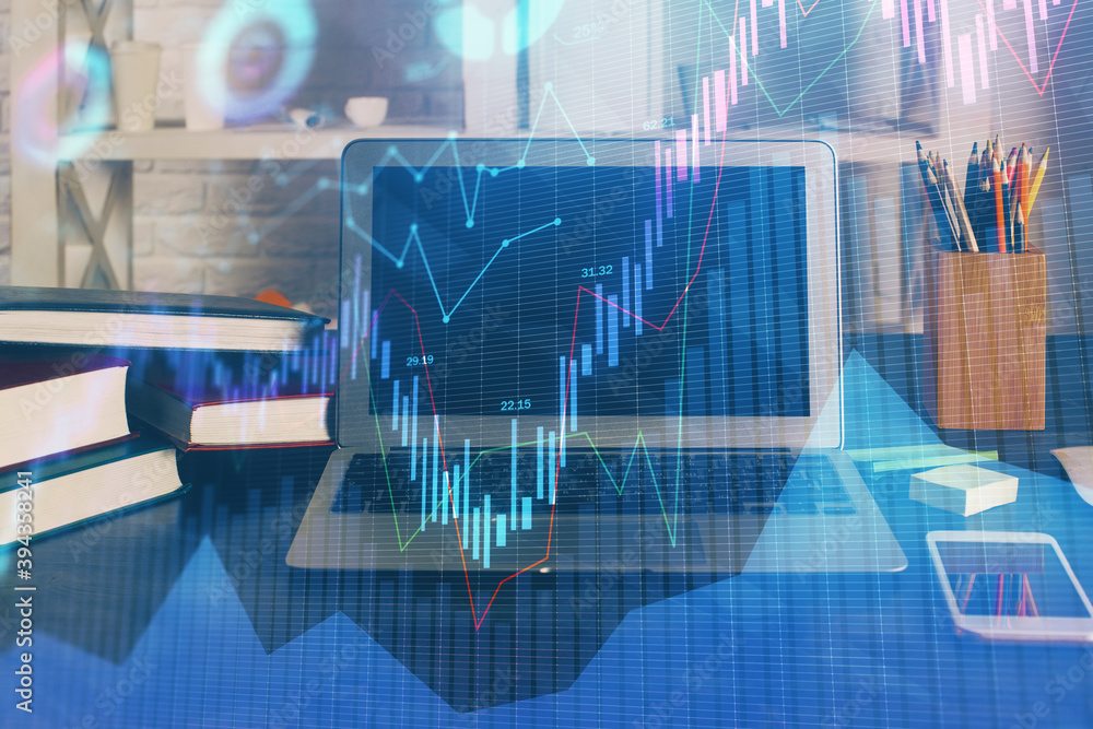 Double exposure of chart and financial info and work space with computer background. Concept of international online trading. Double exposure of chart and financial info and work space with computer background. Concept of international online trading.
